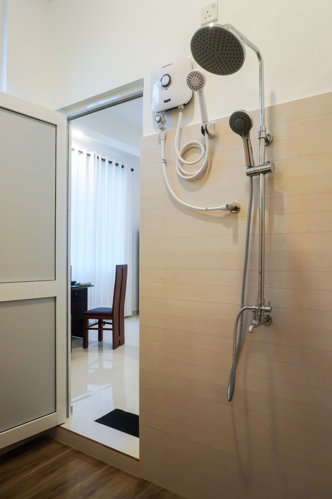 Shower with rain shower head and electric hot water heater